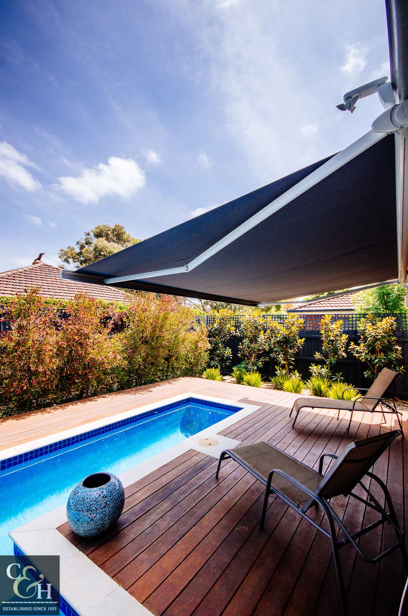 Brustor-B50-Full-Cassette-Folding-Arm-Awnings-10 near the pool