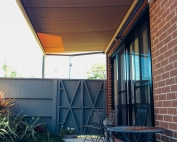 Brustor-B50-Full-Cassette-Folding-Arm-Awnings-12 outside a house