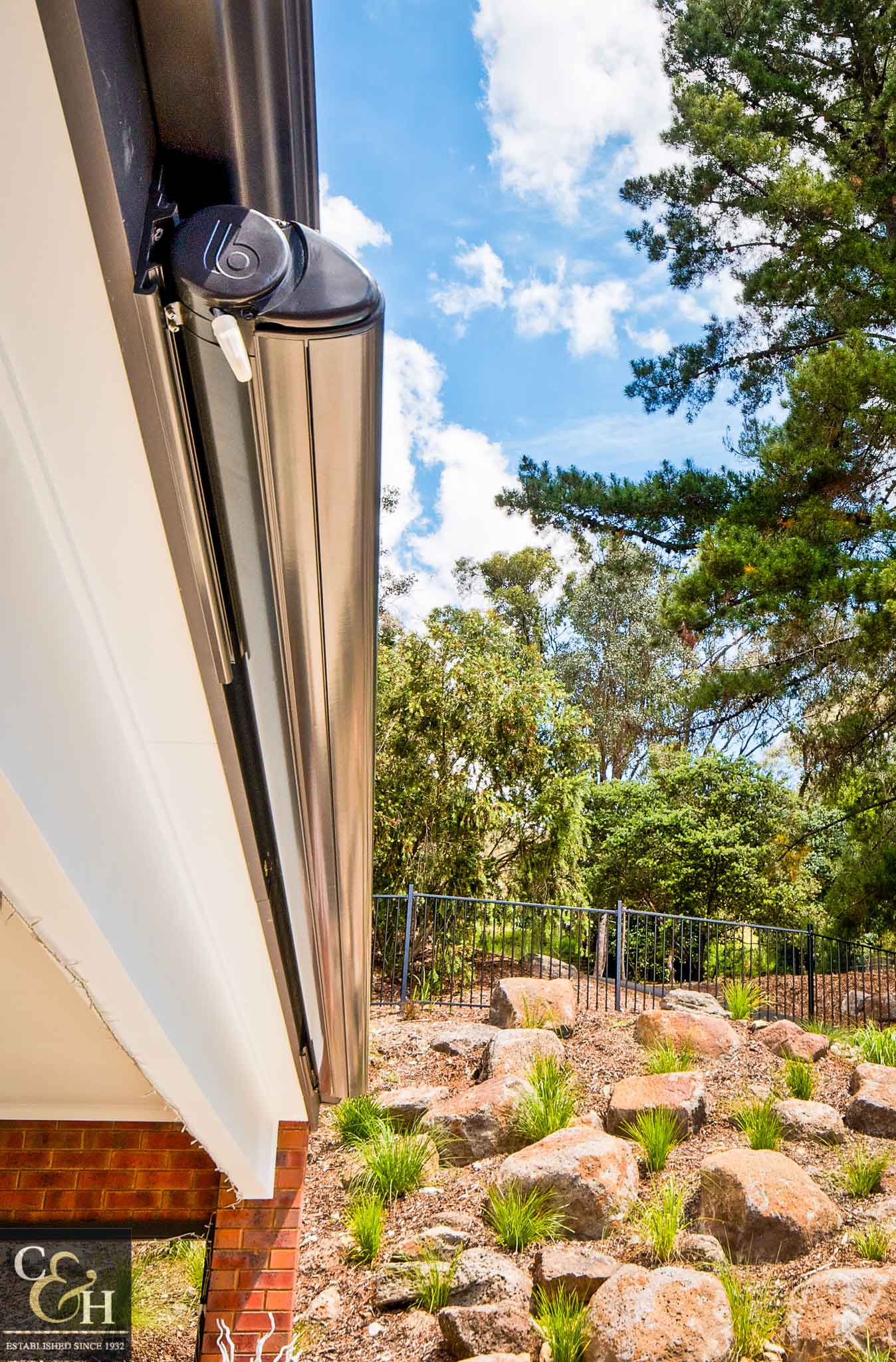 Brustor-B50-Full-Cassette-Folding-Arm-Awnings-4 outside a house