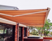 Brustor-B50-Full-Cassette-Folding-Arm-Awnings-5 outside a house