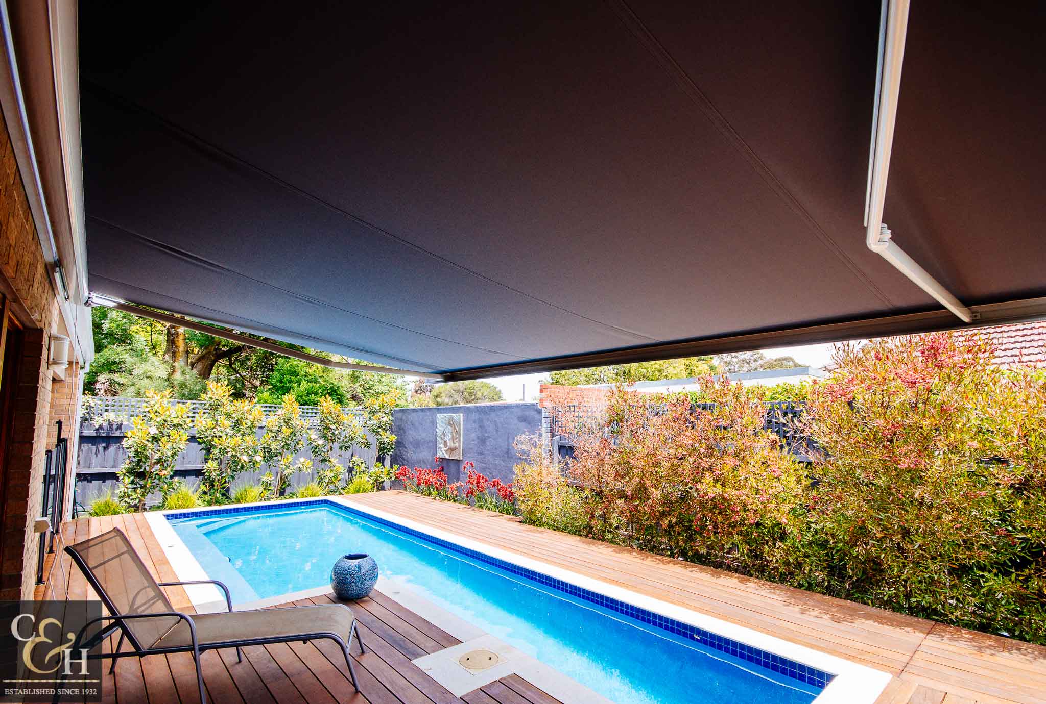 Brustor-B50-Full-Cassette-Folding-Arm-Awnings-9 covering the pool
