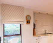 A window with roamn blinds 56 on from Campbell & Heeps