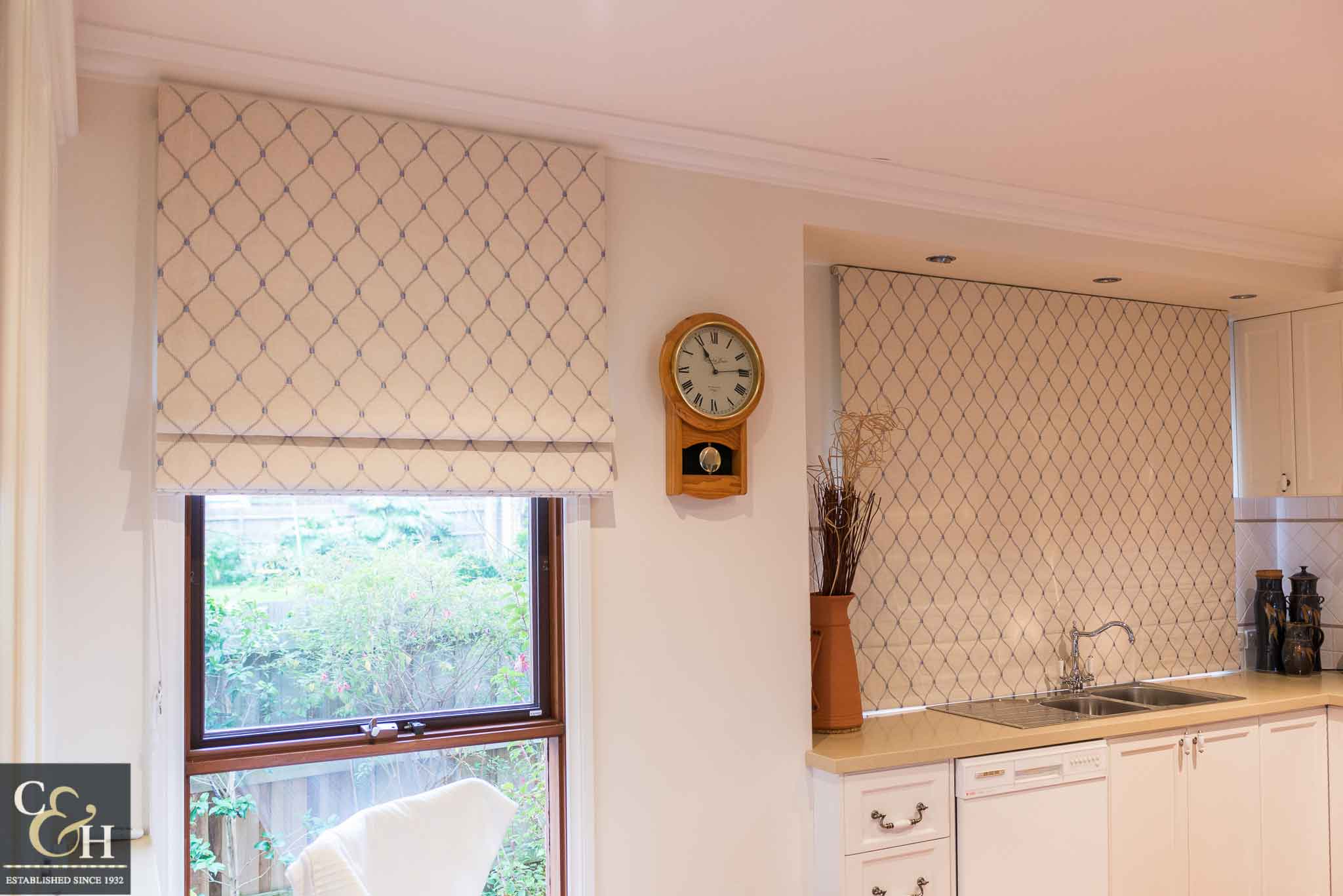 A window with roamn blinds 56 on from Campbell & Heeps